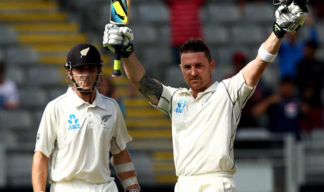 Brendon-McCullum-of-New-Zealand-celebrates-his-century-as-Kane-Williamson-looks-o