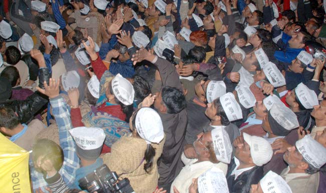 Aam-Aadmi-Party-(AAP)-supporters-gather-outside-party`s-office-where-Delhi-Chief-Minister-Arvind-Kejriwal-announced-his-decision-to-resign-from-his-post-in-New-Delhi-on-1