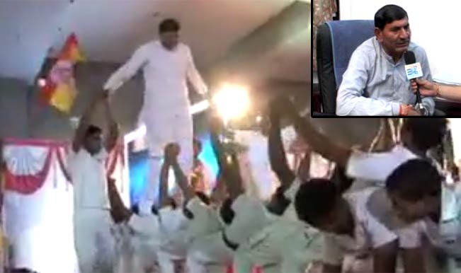 Bhartiya Janata Party's Rajkot candidate walks over children’s backs Bhartiya Janata Party's Rajkot candidate walks over children’s backs