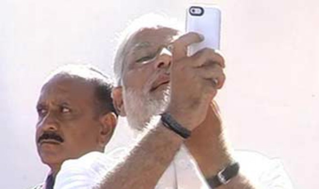 Narendra Modi poses for selfie post voting, attacks Congress’ ‘mother-son’ government Narendra Modi poses for selfie post voting, attacks Congress’ ‘mother-son’ government