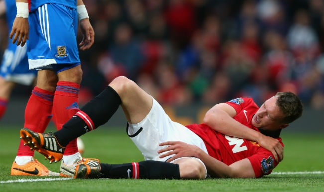 Phil Jones of Manchester United holds his shoulder after sustaining an injury against Hull City (Getty Images)