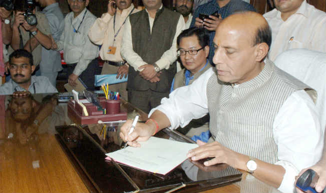Rajnath Singh takes charge