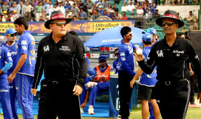 Umpires-Marais-Erasmus-and-K-Srinath-walking-out-on-to-the-field