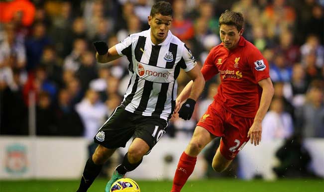 Hatem Ben Arfa of Newcastle tries to shake of Joe Allen's challenge