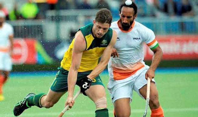 CWG 2014: India to face Australia in hockey final Indian-captain,-Sardar-Singh-tries-to-grab-the-ball-from-Austrailan-player-during-their-hockey-match-at-the-2014-Commonwealth-Games
