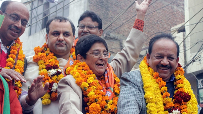  New Delhi: BJP leader Kiran Bedi with party leader Vijay Goel, Union Minister for Science & Technology and Earth Sciences Dr. Harsh Vardhan and others proceeds to file her nomination papers for upcoming Delhi assembly polls at Krishna Nagar, Delhi on Jan 21, 2015. (Photo: Sunil Majumdar/IANS)