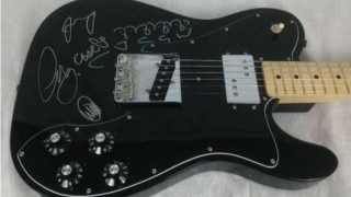 Guitar signed by Coldplay up for sale in Mumbai Guitar signed by Coldplay up for sale in Mumbai
