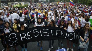 Protesters march in Venezuela, destroy Chavez statue Protesters march in Venezuela, destroy Chavez statue