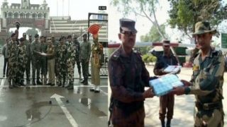 India, Pakistan security personnel exchange sweets at Wagah Border India, Pakistan security personnel exchange sweets at Wagah Border
