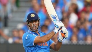 A fan breaches security wall to touch the feet of MS Dhoni but obeys umpire’s request to keep off the wicket A fan breaches security wall to touch the feet of MS Dhoni but obeys umpire’s request to keep off the wicket
