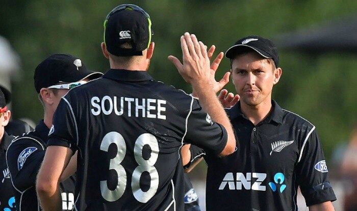 New Zealand's Trent Boult celebrates South Africa's Dwaine Pretorius being bowled with teammate Tim Southee in a match against South Africa