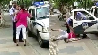 Shocking Video Of Police Officer Slamming Woman And Child In China Goes Viral Shocking Video Of Police Officer Slamming Woman And Child In China Goes Viral