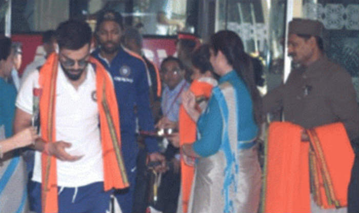 Virat Kohli is welcomed with an saffron scarf after checking in at the hotel in Kanpur, Uttar Pradesh.