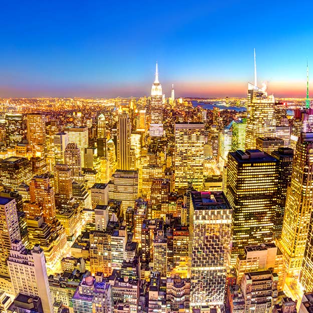 Empire State Building in an illuminated Manhattan downtown skyline