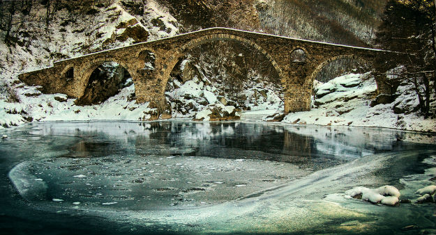 Old stone bridge in Bulgaria during the winter