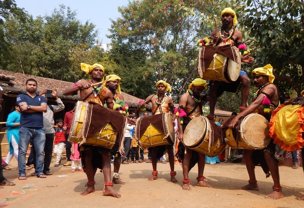 Artists perform Dollu kunitha in Makara Sankranti
