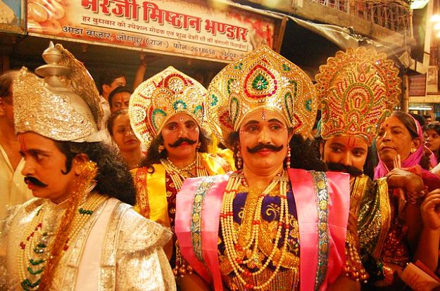 Women masquerading as gods during Dhinga Gavar