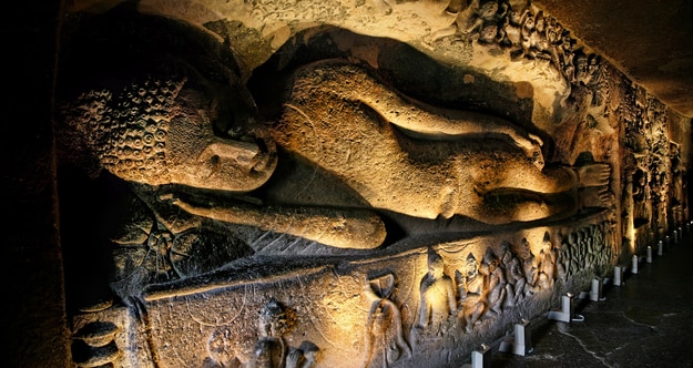 Ajanta Cave with sleeping Buddha statue inside
