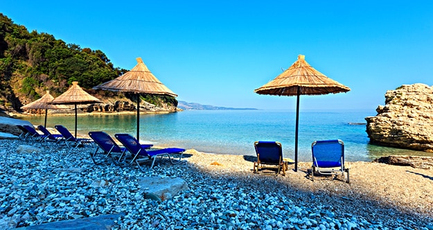 Albania beach with umbrellas