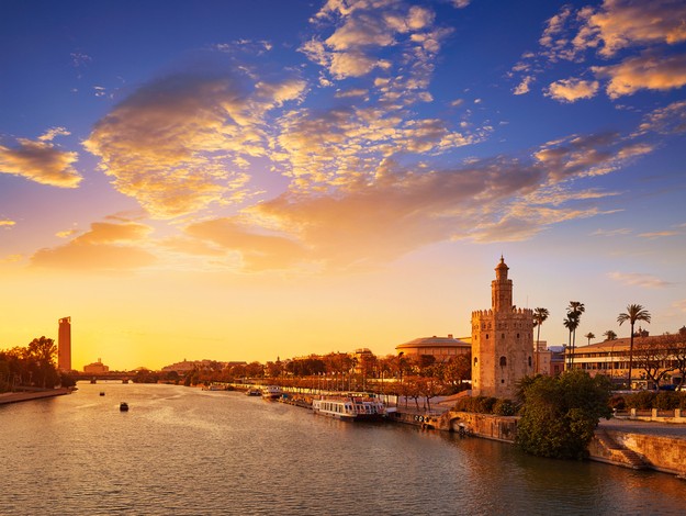 Seville sunset skyline torre del Oro in Sevilla Andalusia Spain