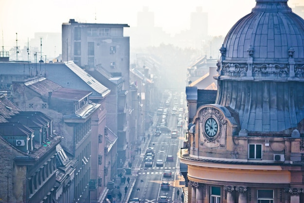 Busy Zagreb street in morning haze with old architecture aerial view