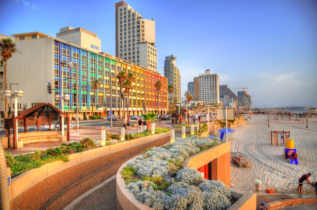 Colorful HDR image of Tel Aviv beach with some of its famous hotels (Mediterranean sea