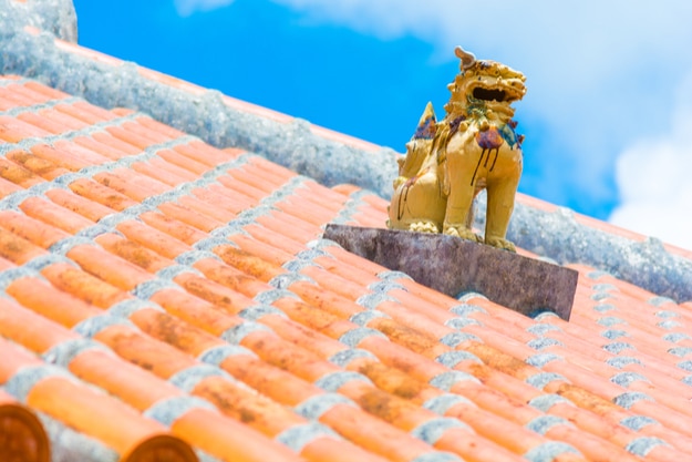 Okinawa Ryukyu style roof with a sculpture of Shasa mythical lion dog