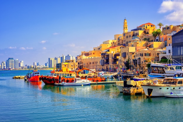 Old town and port of Jaffa and modern skyline of Tel Aviv