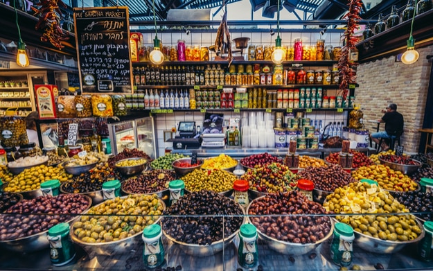 Olives for sale at pupular covered public market called Sarona Market in Tel Aviv