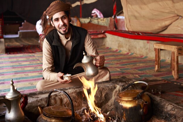 Bedouin man serving Arabic coffee in Wadi Rum,