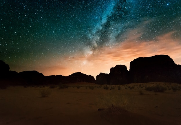 Milky way above red Wadi Rum desert in Jordan
