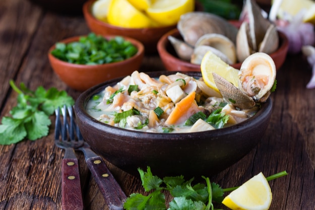 Seafood shellfish ceviche served in a clay bowl, a traditional dish of Peru or Chile