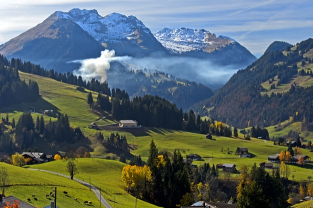 Smoke of fall fires in the Bernese Oberlandthe near Gstaad, Bernese Oberland, Switzerland