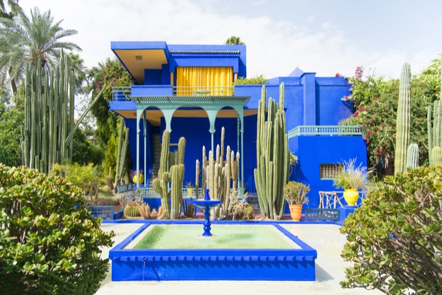 The beautiful Majorelle Garden is a botanical ,tropical garden and artist's landscape garden in Marrakech, Morocco. Le Jardin has a water fountain painted in Majorelle Blue