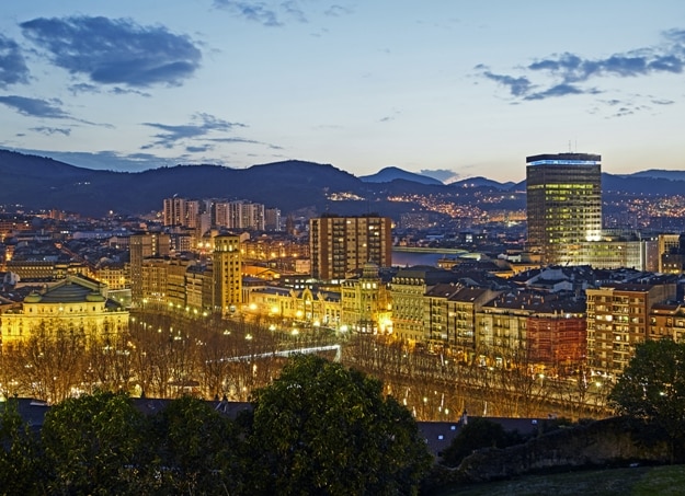 Elevated view of the basque city of Bilbao illuminated at twilight