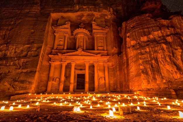 Experience Petra by night by walking the entire Siq to the Treasury to see part of the rock city by candlelight with over 1,500 candles, Petra, Jordan