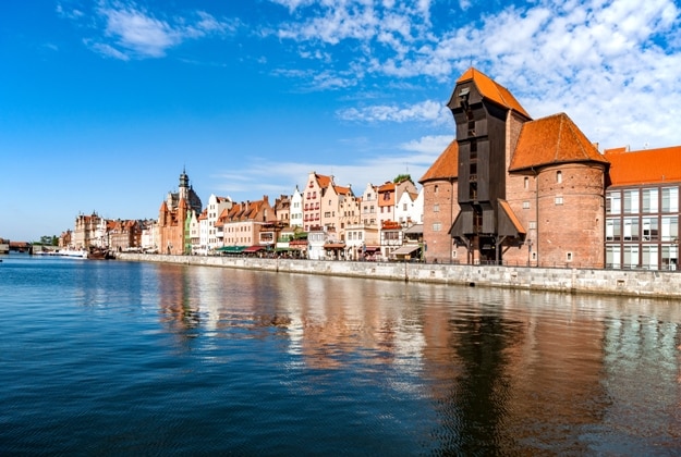 Gdansk old city in Poland with the oldest medieval port crane (Zuraw) in Europe and a promenade along the riverbank of Motlawa River