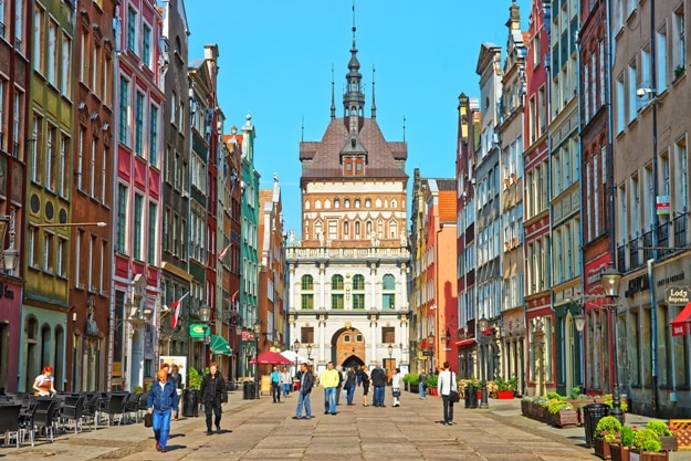 Golden gate and Prison Tower on Dluga Street in the old city center of Gdansk, Poland. People on he background