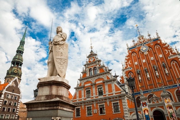 House of the Blackheads, sculpture of Saint Roland and Saint Peters Church in old city Riga, Latvia