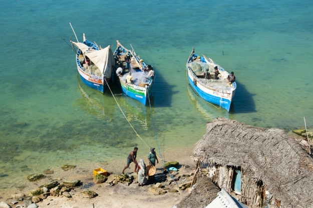 Local fishermen in their wooden boats do fishing on Februari 17, 2013 in Ramesawaram, Tamil Nadu, India. Rameswaram is a major fishing harbor in South India