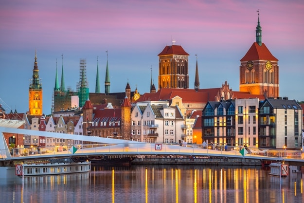 Old town in Gdansk and catwalk over Motlawa river at sunset, Poland