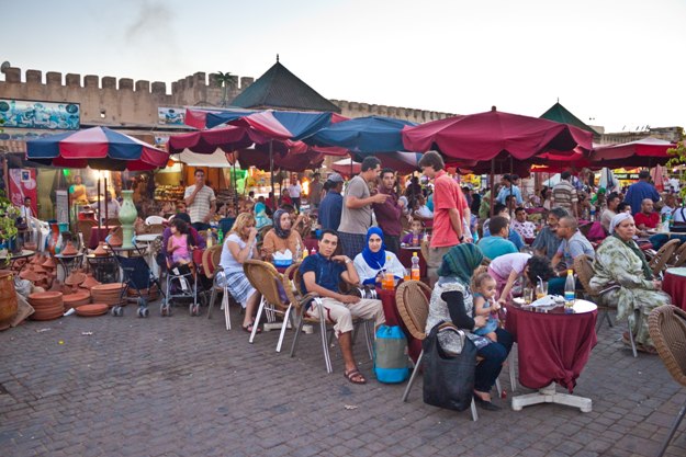 People in a restaurant on a square on July 29, 2010 in Meknes, Morocco. Meknes is a 1000 years old imperial city in Morocco