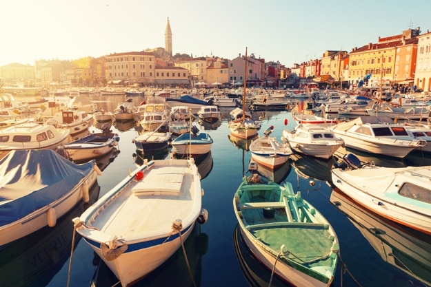 Sunset at medieval town of Rovinj, colorful with houses and church,harbor in Croatia