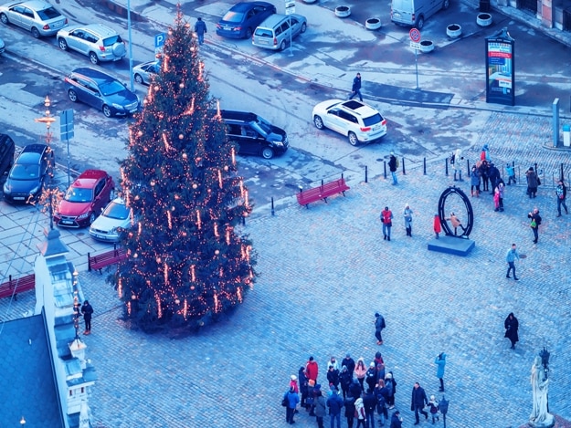 Tourists at Christmas Tree on Town Hall Square in Riga Old Town, in winter