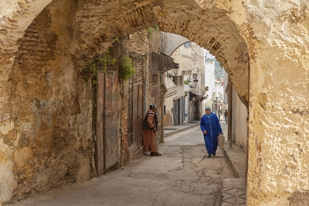 Unidentified people walking in the street of Meknes, Morocco. Meknes is one of the four Imperial cities of Morocco