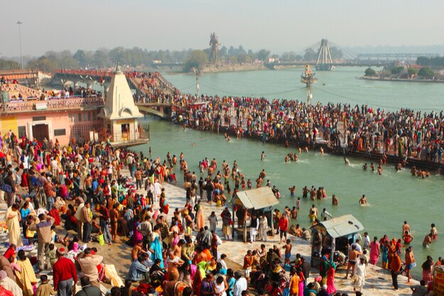 Puja ceremony on the banks of Ganga, people celebrate Makar Sankranti