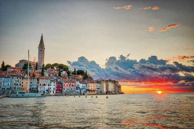 Old town of Rovinj during sunset with a colorful sky and the Adriatic Sea