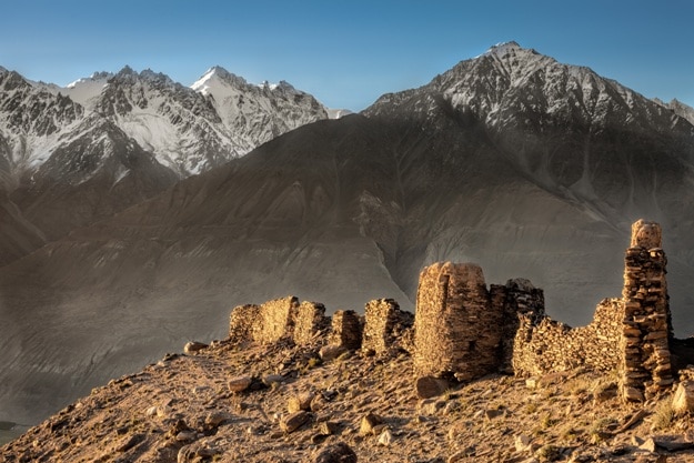 Yamchun Fort is the most visually prominent historic site in the Wakhan Valley in Gorno-Badakhshan Autonomous Province, Tajikistan. The mountains in the distance are in Afghanistan