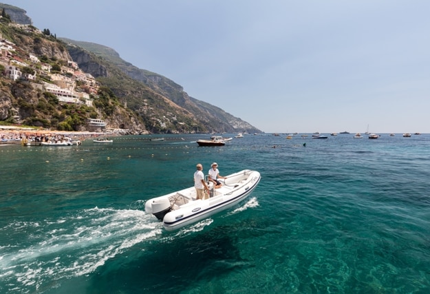 Fast boat on blue sea in Positano. Positano is a small town in Campania, southern Italy