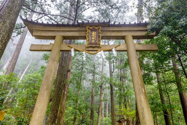 Nachi, Japan at the entrance to Hiryu Temple and Nachi Falls on the Kumano Kodo sacred trail. (Text reads, Hiryu Temple, Annex of Nachi Shrine)